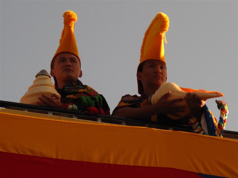 Monks overlook at the coming of their god-King Dalai Lama from his Residence