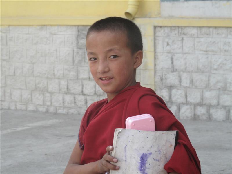 Younk Monk after his class eye the camera.