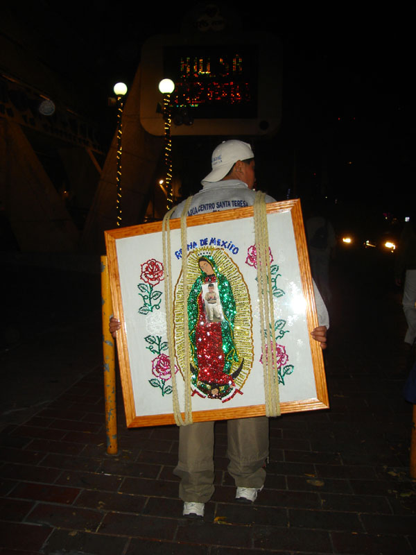 Pilgrim and frame of the Virgin