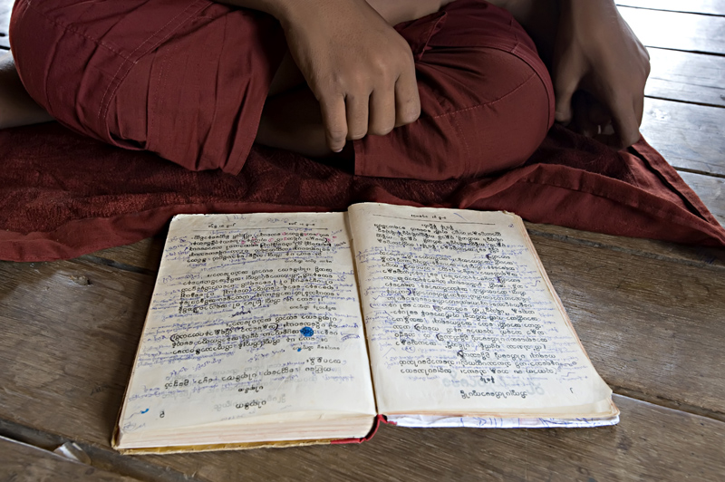 Buddhist monk studying in a temple in Myanmar