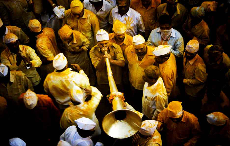 Devotee performing   prayers with  musical instrument during Yatra of Lord Khandoba  at Jejuri tample