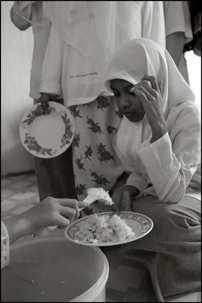 A girl gets her lunch at an orphanage in Banda Aceh Indonesia