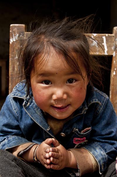 A portrait of a young girl in one of the primary schools in the region. The region only offers primary education. Lobas have to go out of their region for further education and jobs.