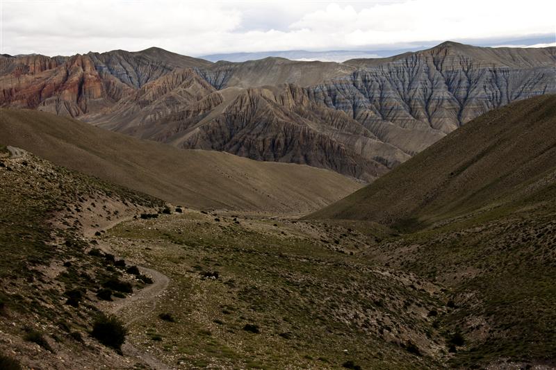 The different colors in mountains are the most striking in Upper Mustang that goes beyond the Tibet plateau.