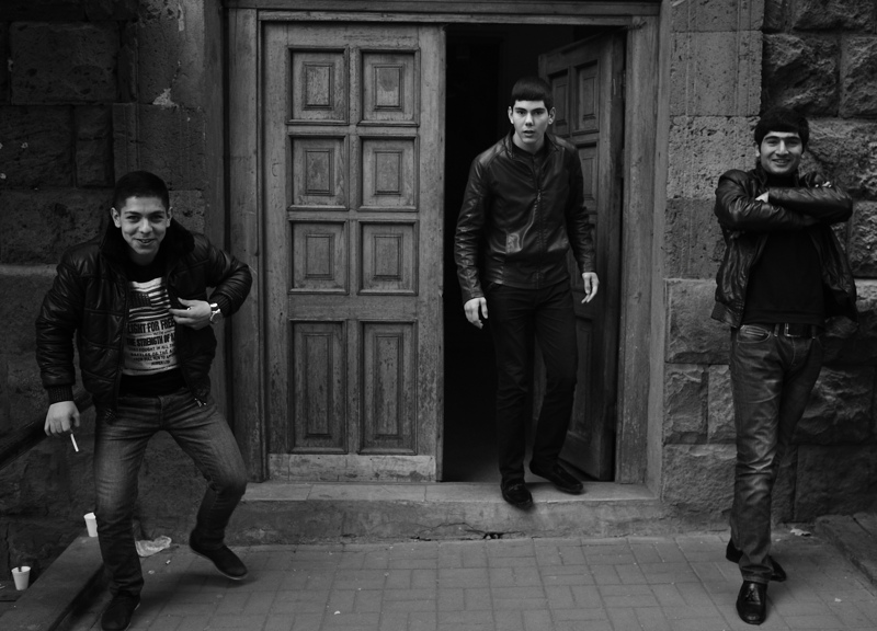 Young men emerging from a tavern