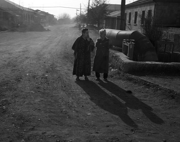 The women in conversation on the side of the road