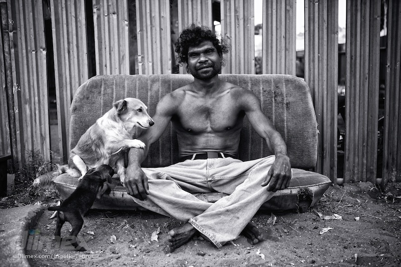 Billy’ Stuart Ah Choo sitting outside his home in Kennedy Hill with his beloved dog