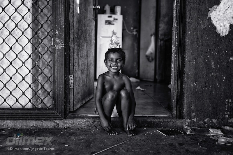 Marjorie was happily smiling while sitting on the doorstep