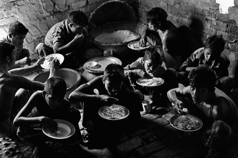 At brickfield, workers have only rice and vegetables for their lunch