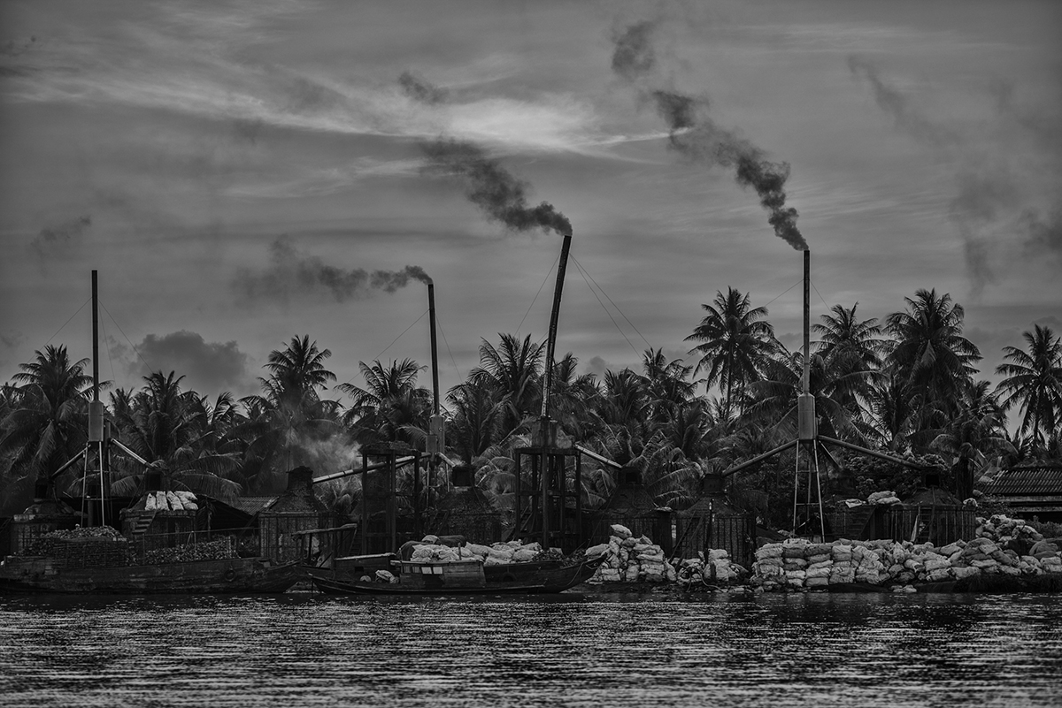 Smoke billows from one of the many factories that repurpose coconut husks