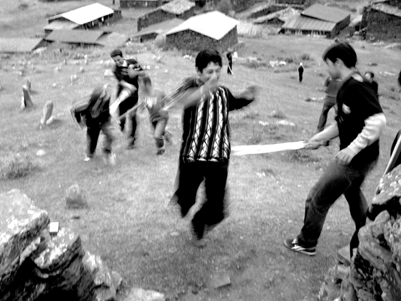 All men have to cross the "peacekeepers" with wooden swords in order to get up the hill