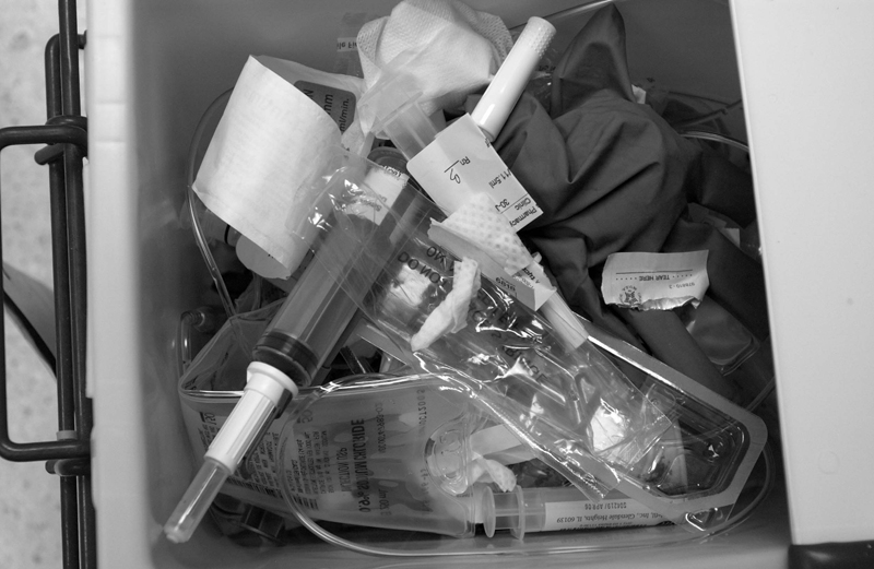One treatment's garbage fills a medical waste container