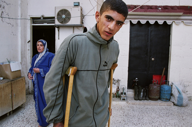 Ali, a cluster bomb victim, with his mother, Aarab Salim, Lebanon
