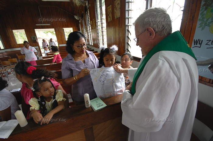 Baptise Ceremony in one village's Roman Catholic Church : Suriname