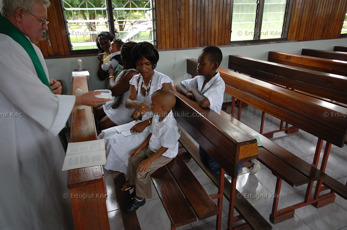 Baptise Ceremony in one village's Roman Catholic Church : Suriname