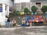 Tibetan Refugees sit along streets outside the Dalai Lama's residence in Dharamsala