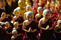 Praying monks statuettes
