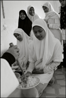 Girls having lunch at an orphanage in Banda Aceh Indonesia