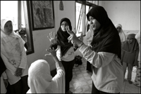 Students of the Fajar Hidayah organization play a game with girls at an orphanage in Banda Aceh Indonesia