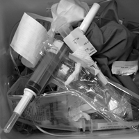 One treatment's garbage fills a medical waste container